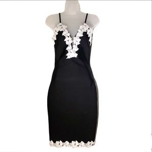 Banjul Black bodycon dress with white lace plunging neckline. Super sexy Size S